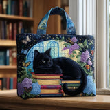 Handgemachte Chat Noir Tasche auf Büchern